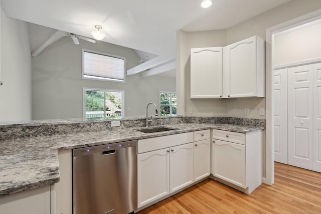 kitchen with white cabinetry, dishwasher, sink, light stone counters, and light hardwood / wood-style floors