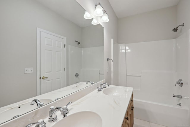 bathroom with tile patterned flooring, vanity, and tub / shower combination