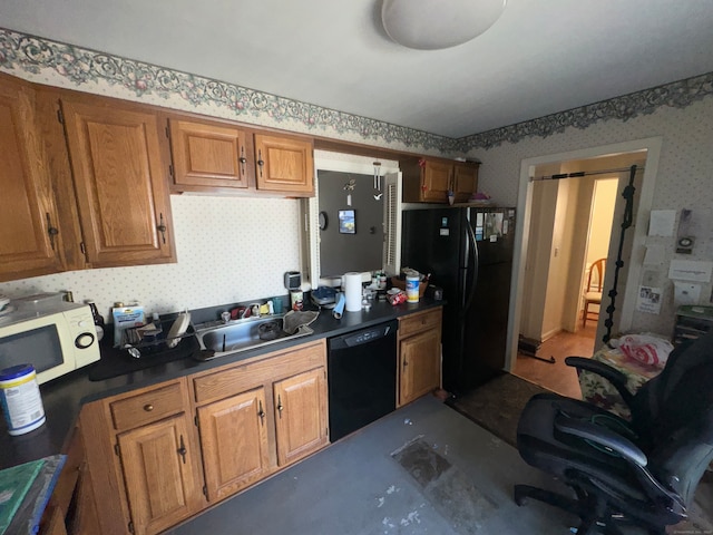 kitchen featuring sink and black appliances