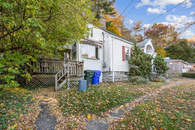 view of side of property with a deck