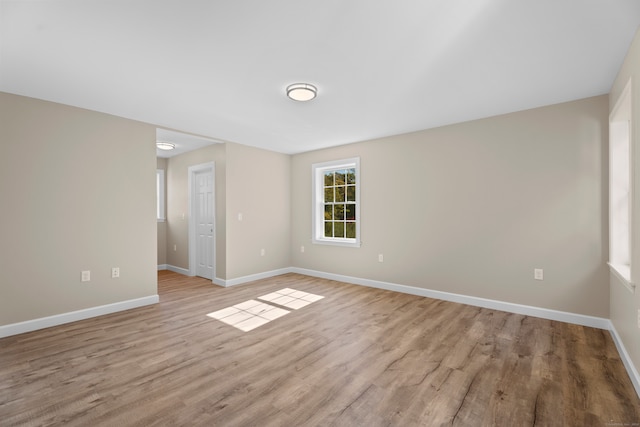 unfurnished room featuring light wood-type flooring