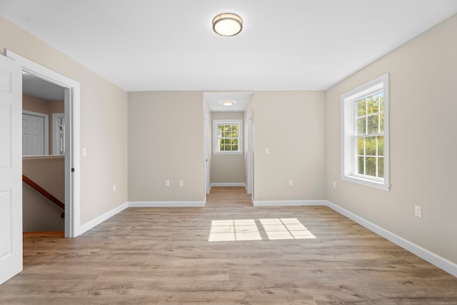 empty room with light hardwood / wood-style floors