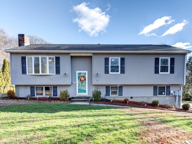 bi-level home with a front yard