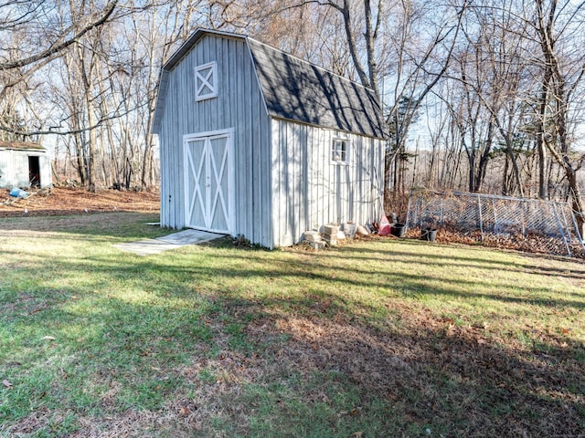 view of outbuilding featuring a yard