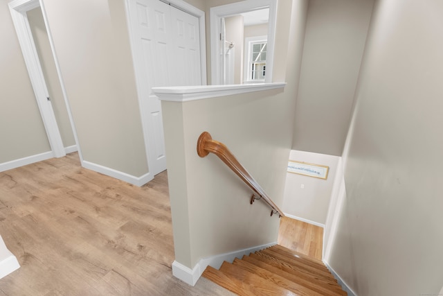 staircase featuring hardwood / wood-style flooring