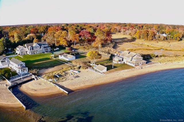 bird's eye view featuring a water view and a view of the beach