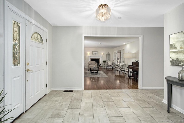 foyer featuring an inviting chandelier