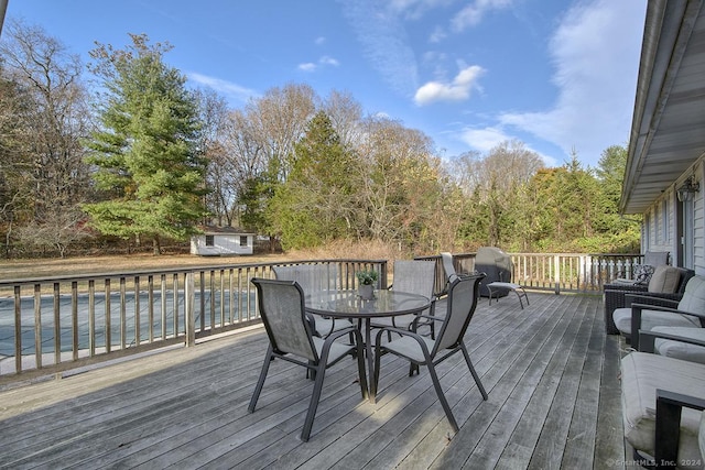 wooden terrace with an outdoor structure