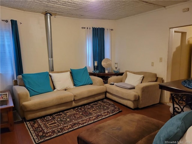 living room with a healthy amount of sunlight, a textured ceiling, and hardwood / wood-style floors