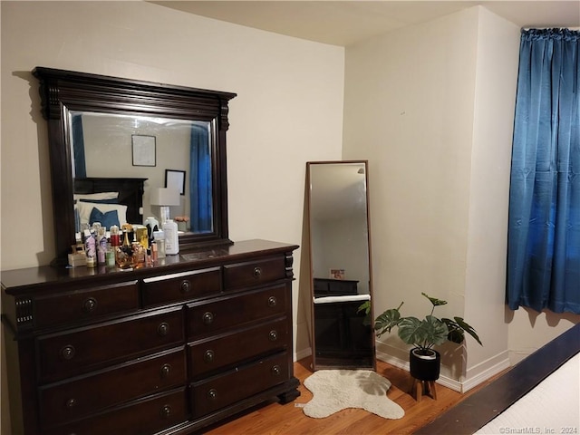 bedroom with light hardwood / wood-style flooring