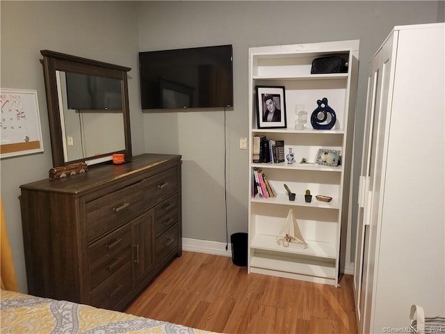 bedroom with light hardwood / wood-style floors