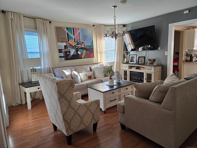 living room with a chandelier and hardwood / wood-style flooring