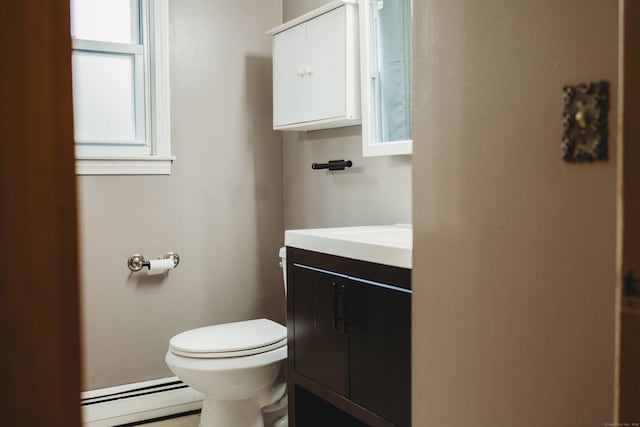 bathroom featuring vanity, a baseboard radiator, and toilet