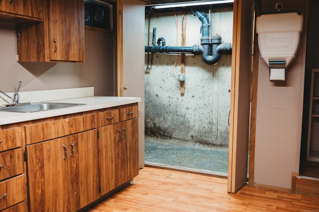 kitchen featuring sink and light wood-type flooring