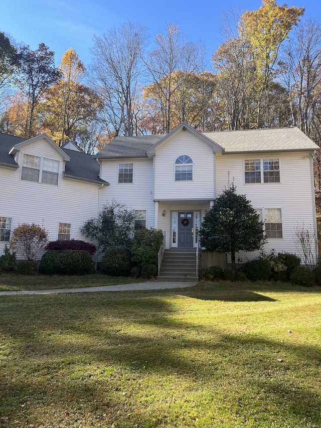 view of front of home with a front lawn