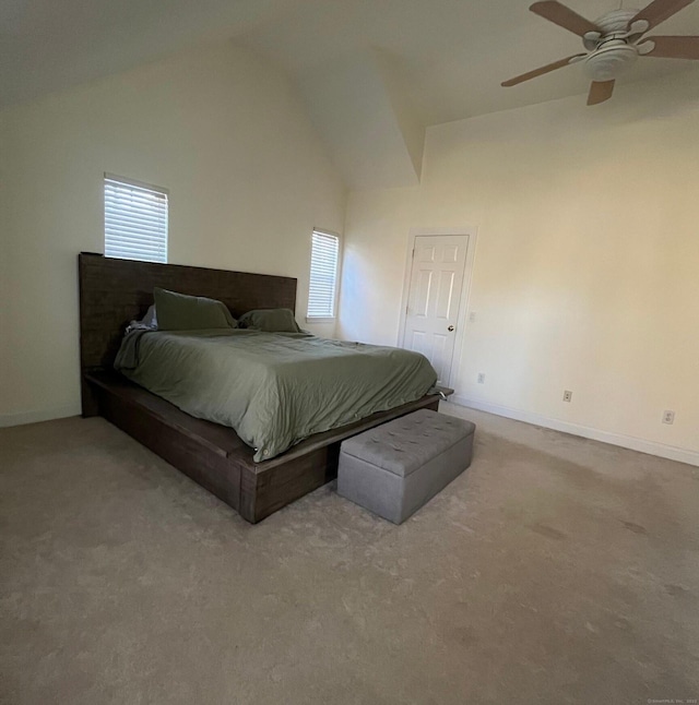 carpeted bedroom with ceiling fan and lofted ceiling