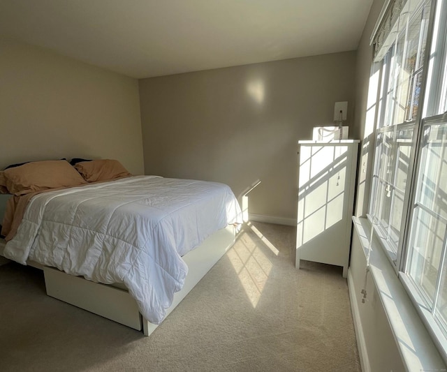 bedroom with light carpet