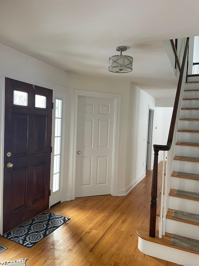 entrance foyer with light hardwood / wood-style flooring