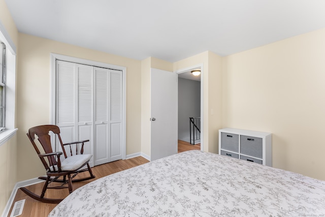 bedroom featuring a closet and wood-type flooring