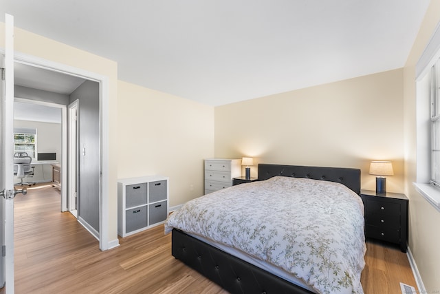 bedroom with hardwood / wood-style floors