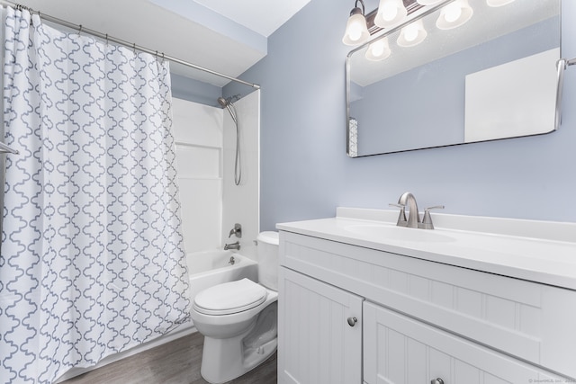 full bathroom with toilet, shower / tub combo with curtain, vanity, and wood-type flooring