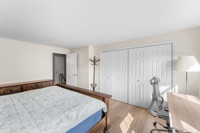 bedroom featuring a closet and light hardwood / wood-style floors