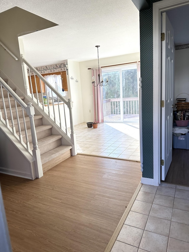 interior space featuring wood-type flooring and a chandelier