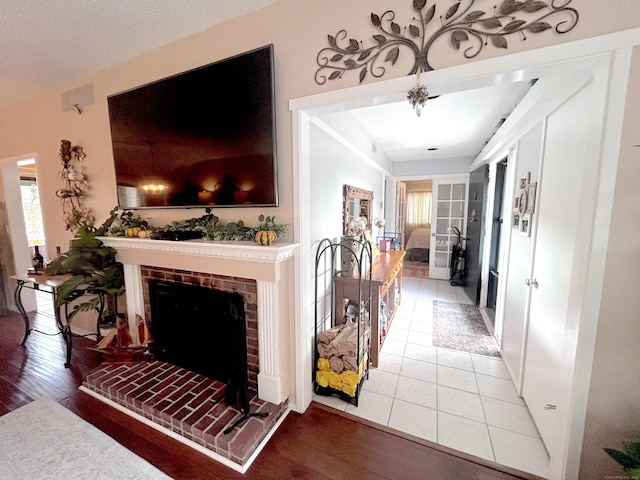 living room with a fireplace and hardwood / wood-style floors