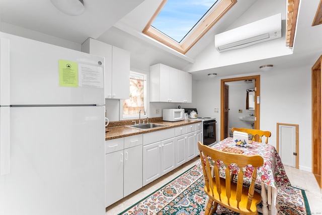 53 Breen Ave, Old Lyme, CT 06371 - kitchen featuring white appliances, a sink, a wall unit AC, a skylight, and white cabinets