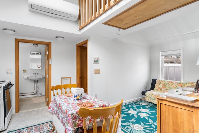 dining area featuring light tile patterned flooring and a wall mounted air conditioner