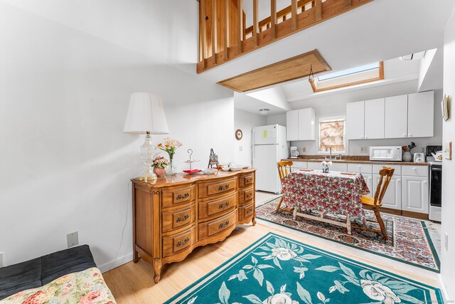 53 Breen Ave, Old Lyme, CT 06371 - dining space featuring light wood-style flooring and attic access