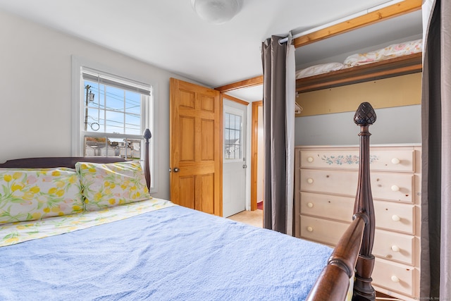 bedroom featuring light colored carpet