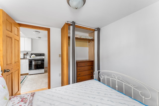 tiled bedroom featuring a closet