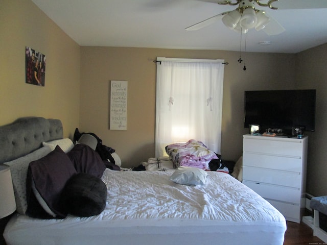 bedroom featuring ceiling fan and wood-type flooring