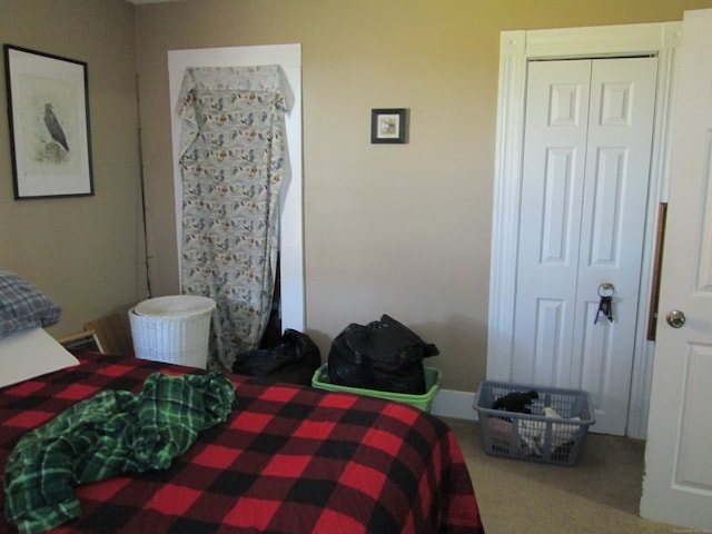 carpeted bedroom with a closet