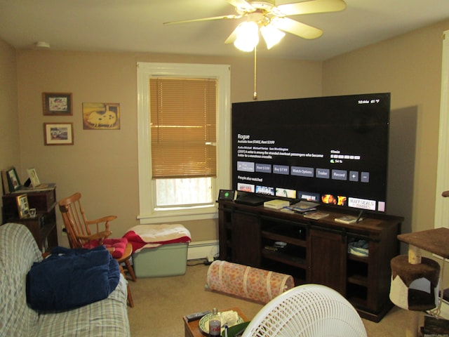 recreation room with carpet floors, baseboard heating, and ceiling fan