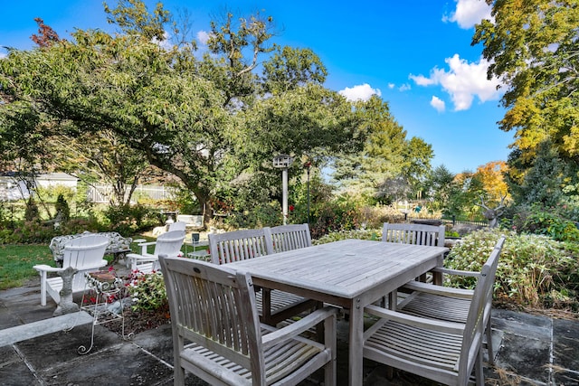 wooden terrace featuring a patio area