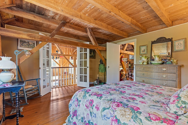 bedroom with wood finished floors, wooden ceiling, french doors, and wallpapered walls