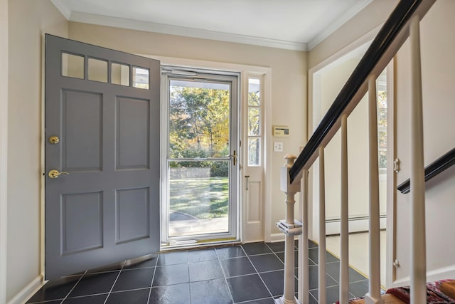 entrance foyer with stairs, dark tile patterned floors, baseboard heating, and crown molding