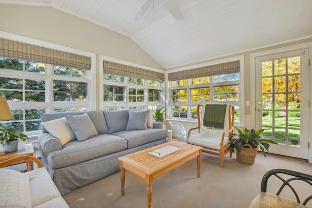 sunroom / solarium with lofted ceiling and a ceiling fan