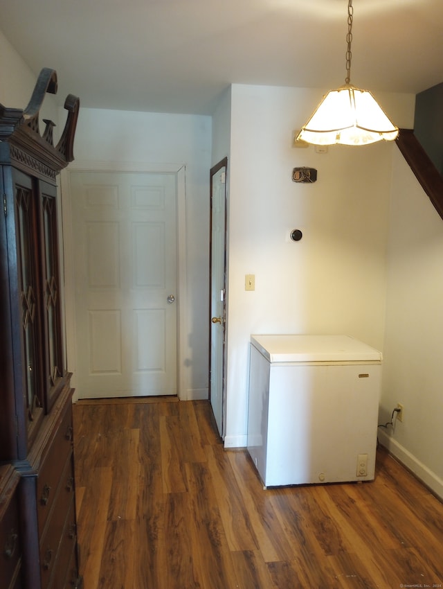 laundry area featuring dark hardwood / wood-style flooring