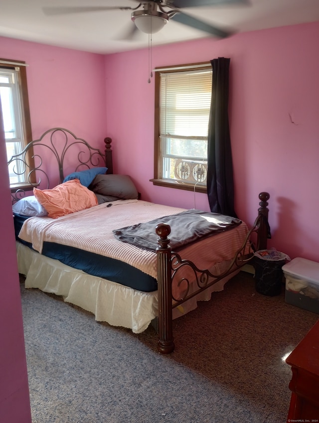 carpeted bedroom featuring ceiling fan