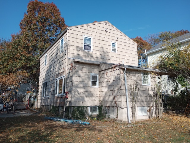 view of side of home featuring a yard