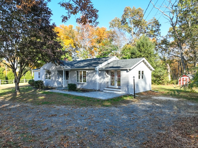 ranch-style house with a shed