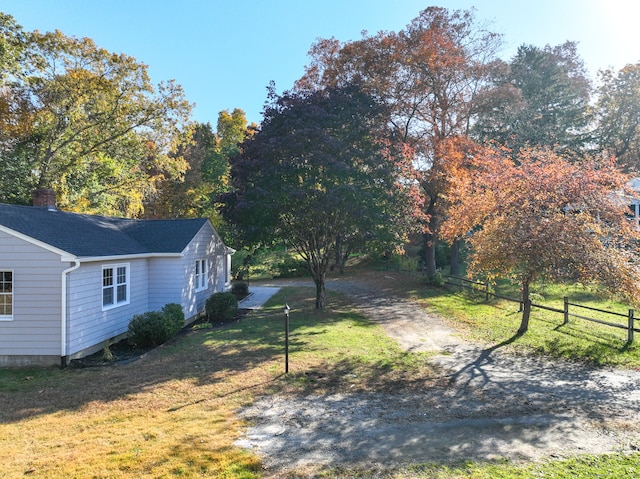 view of home's exterior with a lawn