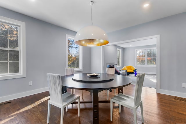 dining area featuring dark hardwood / wood-style floors