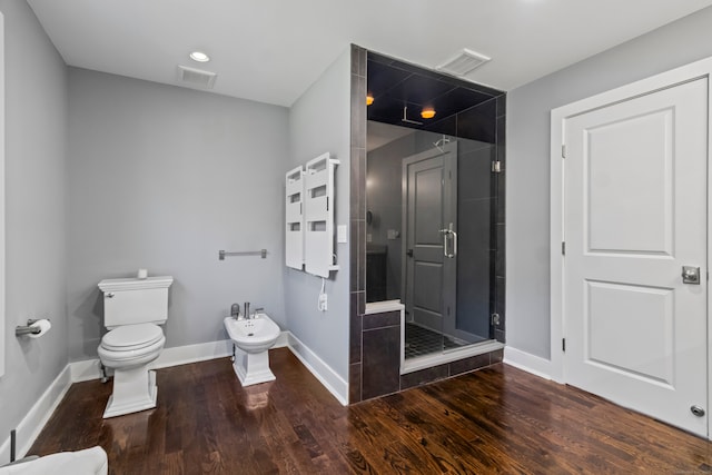 bathroom featuring hardwood / wood-style floors, a bidet, toilet, and an enclosed shower