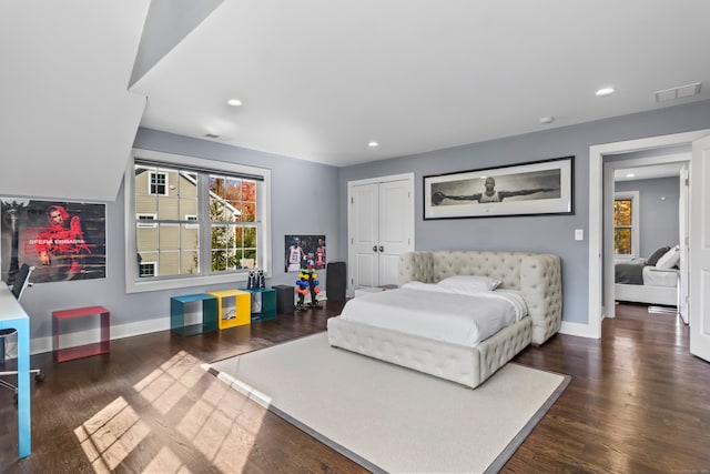 bedroom with dark wood-type flooring