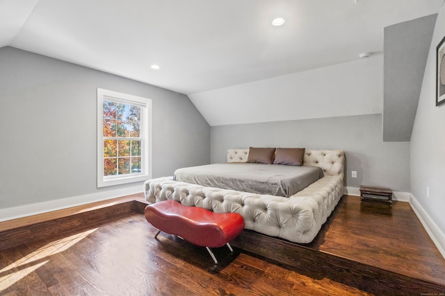 bedroom featuring vaulted ceiling and hardwood / wood-style floors