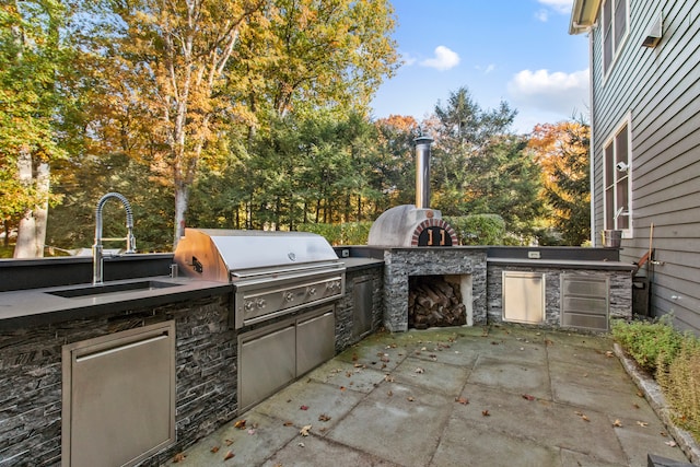 view of patio featuring sink, grilling area, and area for grilling